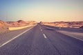 Desert road at sunset, color toning applied, Egypt Royalty Free Stock Photo