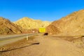 Desert road, with a warning sign Royalty Free Stock Photo