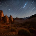 Desert rock formations with long exposure star trails at night Royalty Free Stock Photo