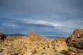 Desert rock formations with snowy mountain range in Eastern Sierra Nevadas California Royalty Free Stock Photo