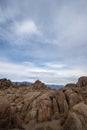 Desert rock formations with snowy mountain range in Eastern Sierra Nevadas California Royalty Free Stock Photo