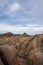 Desert rock formations with snowy mountain range in Eastern Sierra Nevadas California Royalty Free Stock Photo