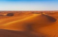 Desert sand and dunes with clear blue sky. Royalty Free Stock Photo