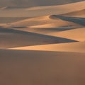 1060 Desert Sand Dunes: A serene and picturesque background featuring desert sand dunes in warm and sandy colors that create a t