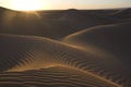 Desert sand dunes with sunset