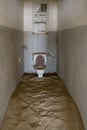 desert sand engulfing water bowl at toilet of forsaken hospital at mining ghost town in desert, Kolmanskop, Namibia