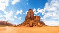 Desert, sandstone mountains and cloudy sky