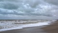 Desert sandy beach, gray sky and clouds, autumn cloudy sky Royalty Free Stock Photo