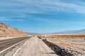Desert scenic road in Death Valley with mountain backdrop, California, USA. Amazing natural panorama Royalty Free Stock Photo