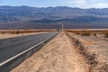 Desert scenic road in Death Valley with mountain backdrop, California, USA. Amazing natural panorama Royalty Free Stock Photo