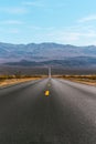 Desert scenic road in Death Valley with mountain backdrop, California, USA. Amazing natural panorama Royalty Free Stock Photo