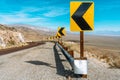 Desert scenic road in Death Valley with mountain backdrop, California, USA. Amazing natural panorama Royalty Free Stock Photo