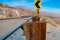 Desert scenic road in Death Valley with mountain backdrop, California, USA. Amazing natural panorama Royalty Free Stock Photo