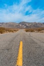 Desert scenic road in Death Valley with mountain backdrop, California, USA. Amazing natural panorama Royalty Free Stock Photo