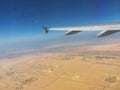 Desert seen from the airplane window flying in the sky