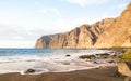 Desert solitary beach in Tenerife with Los Gigantes cliffs