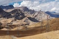 Desert with stone mountains landscape with electricity and telecommunication towers in countryside of India