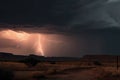 desert storm with lightning and thunder, illuminating the distant storm clouds Royalty Free Stock Photo