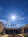 Desert  SUNBURST Sun Flares Sun Rays Palm Trees  Blue Sky clouds  Structure  Nature  Photography Royalty Free Stock Photo