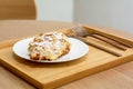 Desert and sweet bakery concept. Close up croissant almond on a white plate in cafe and coffee shop Royalty Free Stock Photo