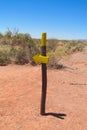 Desert trail and direction arrow sign Royalty Free Stock Photo