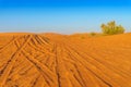 Desert Yellow Sand Dunes Landscape with Tire Tracks