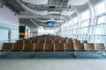 Deserted airport terminal. Rows of empty seats in the waiting room Royalty Free Stock Photo