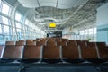 Deserted airport terminal. Rows of empty seats in the waiting room Royalty Free Stock Photo