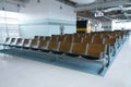 Deserted airport terminal. Rows of empty seats in the waiting room Royalty Free Stock Photo