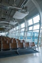 Deserted airport terminal. Rows of empty seats in the waiting room Royalty Free Stock Photo