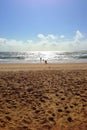 Deserted beach with family and children Royalty Free Stock Photo