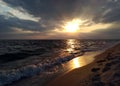 Deserted beach line. Sunset at sea before the storm.