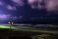 Deserted beach at night with Siren Royalty Free Stock Photo