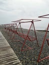 Deserted beach. Prohibition. Epidemic. Quarantine. Deserted place. Sea. Swing. Royalty Free Stock Photo