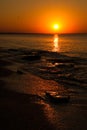 Deserted beach at sunset