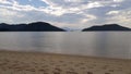 Deserted beach in tropical bay surrounded by mountains. Brazilian seascape, Paraty mirim