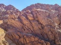 Deserted brown-orange stone mountain in the Sinai desert against the blue sky Royalty Free Stock Photo