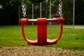 An deserted children's swing in a children's playground. Royalty Free Stock Photo
