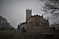 Deserted church and Gothic graveyard, in the bleakness of winter.