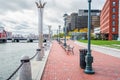 Deserted harbourside footpath on an overcast autumn day Royalty Free Stock Photo