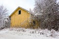 Deserted house and snowy road