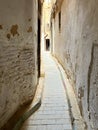 Deserted, narrow passageway in the ancient city of Fez, Morocco Royalty Free Stock Photo