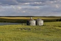 Deserted old round grain bins Royalty Free Stock Photo