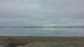 A deserted pebble beach on the Pacific Ocean coast. Royalty Free Stock Photo