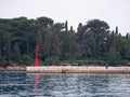 Deserted pier in the port. Small ripples on the surface of the sea. Royalty Free Stock Photo