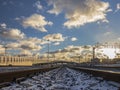 Deserted railway tracks leading to the horizon and  intersecting overpasses Royalty Free Stock Photo