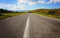 Deserted road on a cloudy day Royalty Free Stock Photo