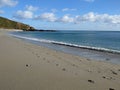 The deserted sand at Vault Beach, Cornwall on a bright sunny day Royalty Free Stock Photo