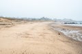 Empty sandy beach on a foggy autumn day Royalty Free Stock Photo