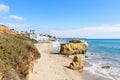 Deserted sandy beach with sea stacks on the coast of California ona sunny autumn day